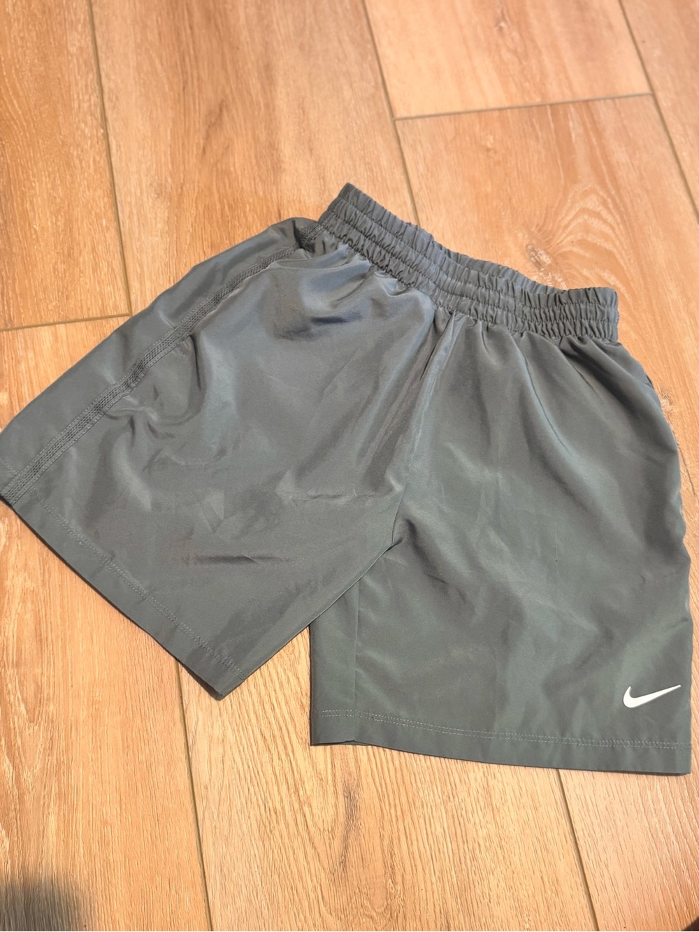 Nike Gray Athletic Shorts with White Swoosh
